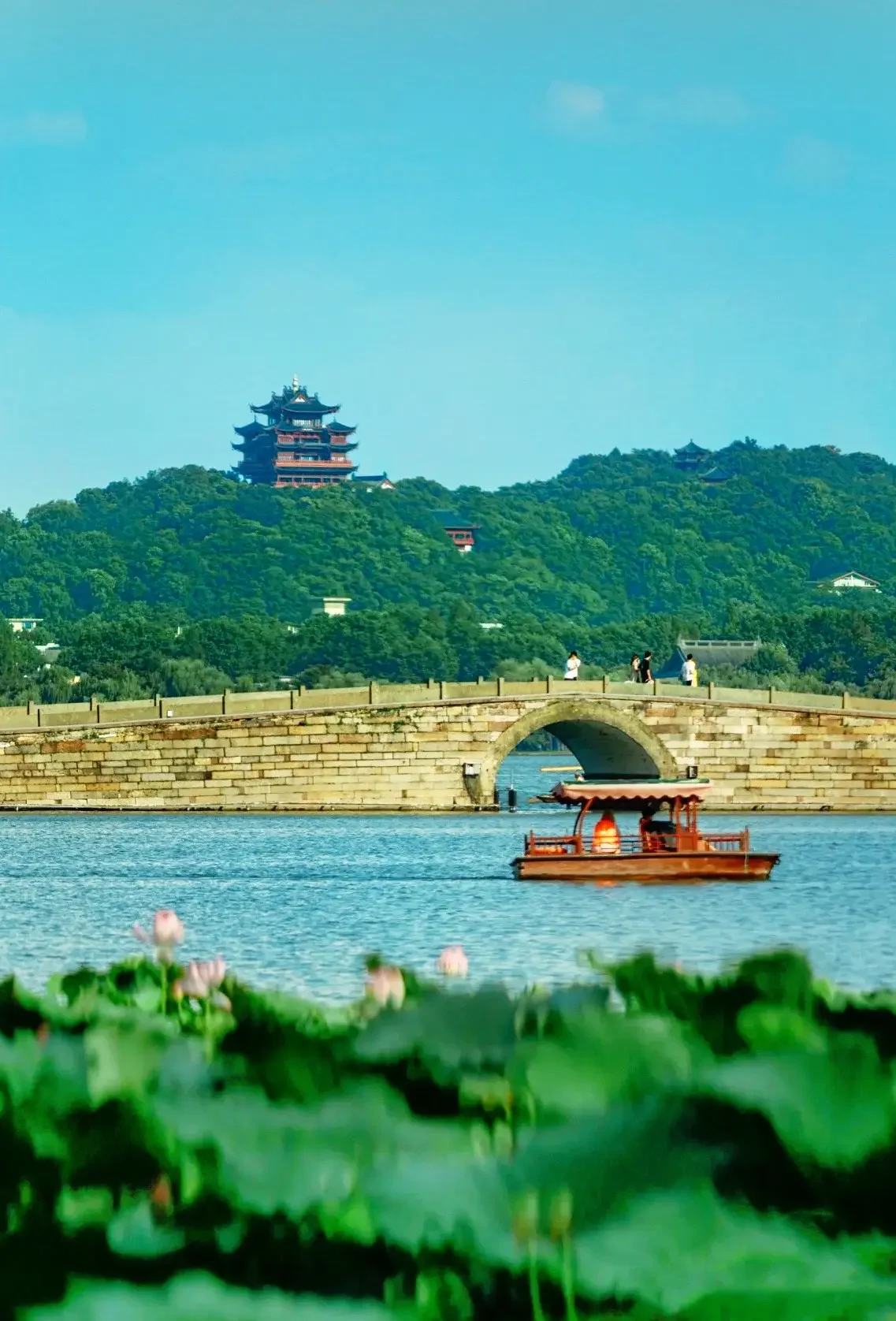 Traditional bridge and pavilion beside the water