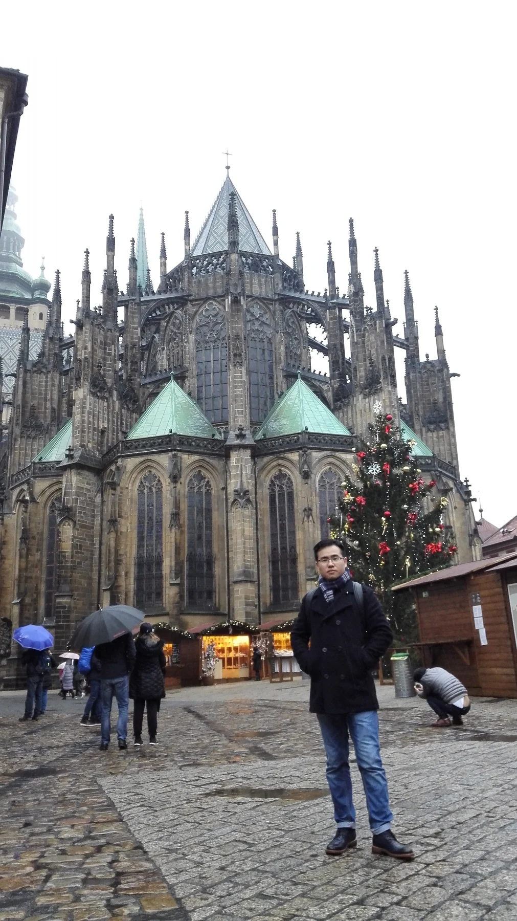 Man standing outside a stone cathedral