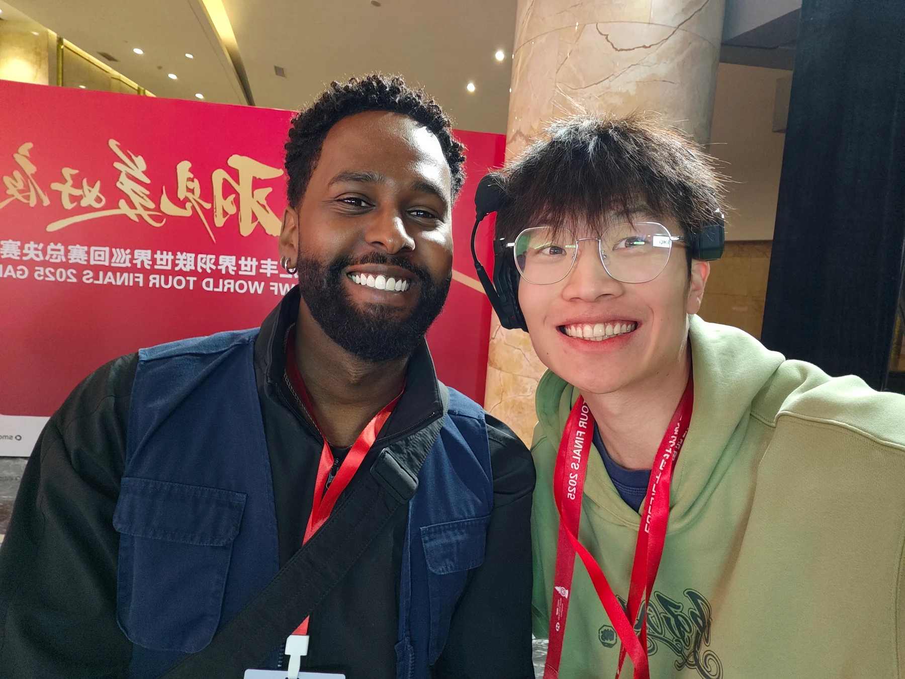 Two people smiling together at an event
